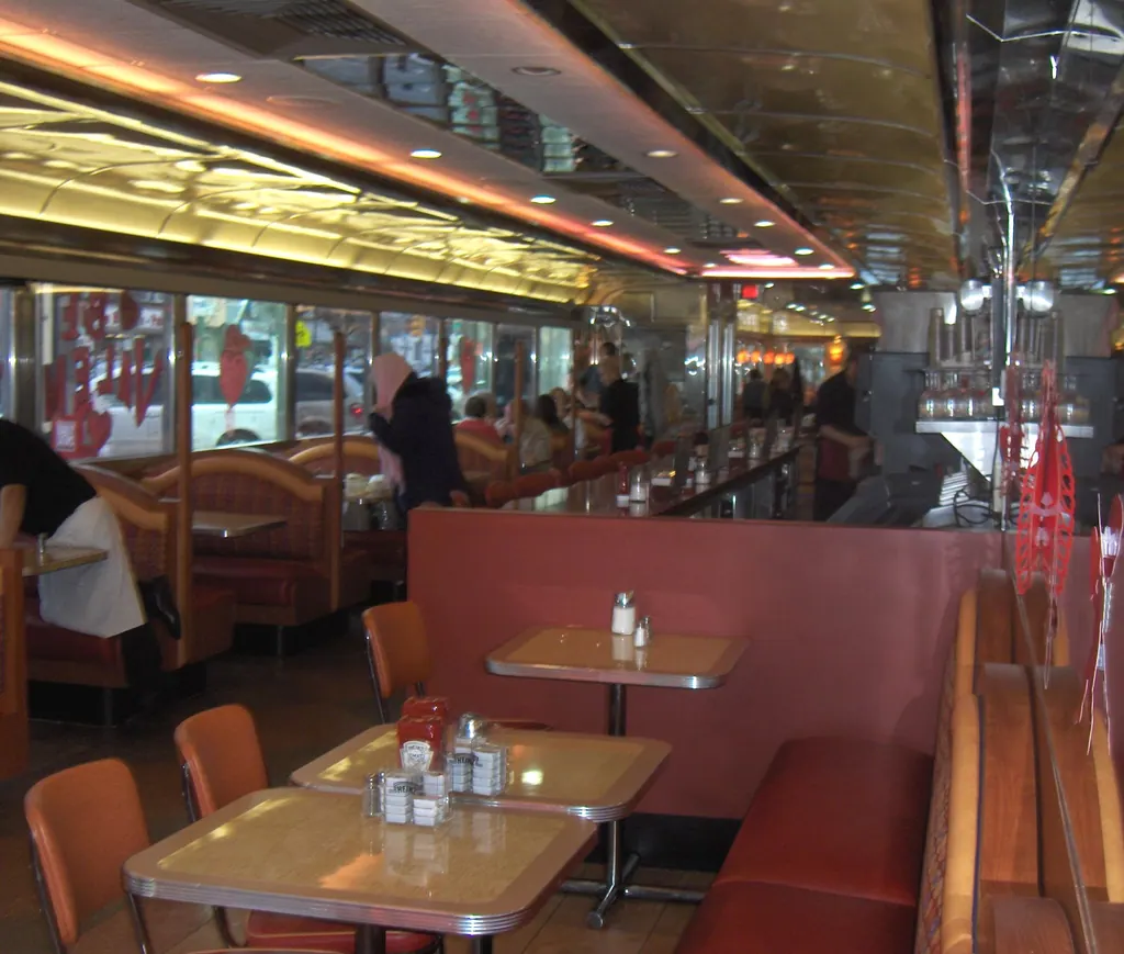 Booths, tables and a long counter inside a classic American diner in Philadelphia